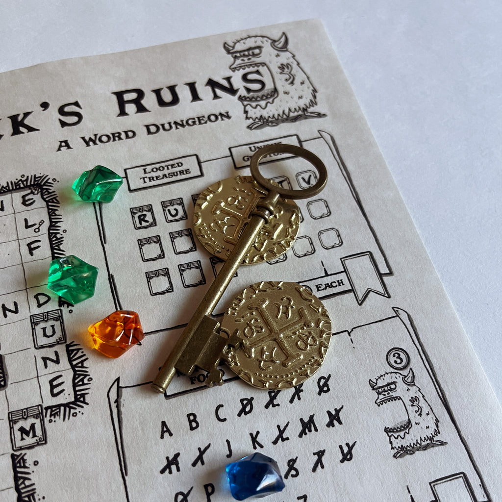 Rumpledonk's Ruins scoring area with letters crossed off, a key and coins
